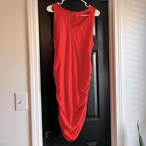 Sleeveless coral dress.